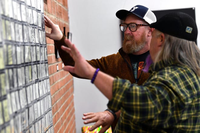 C.J. Allen talks about his Doodle Art Project at 1117 Studios & Gallery on Jan. 14. Made mostly of doodles on 3x3 Post-it Notes, the exhibit features his own work and that of others who joined him in collaborating in the project.