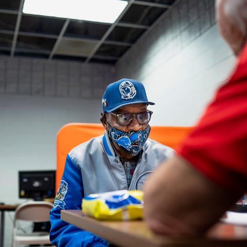 Detroit resident Cornelius Chatman talks with volu