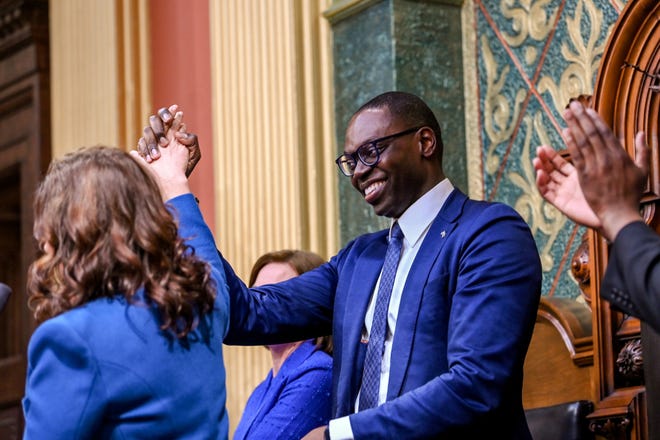 Gov.  Gretchen Whitmer, left, shakes hands with Lt. Gov.  Garlin Gilchrist during her de ella State of the State address on Wednesday, Jan. 25, 2023, at the Michigan State Capitol in Lansing. 