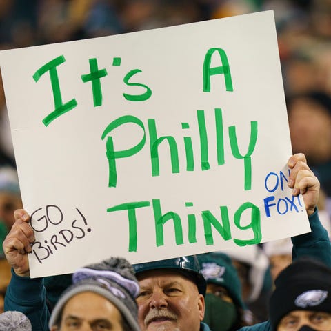 Philadelphia Eagles fans with a sign "It's a Phill