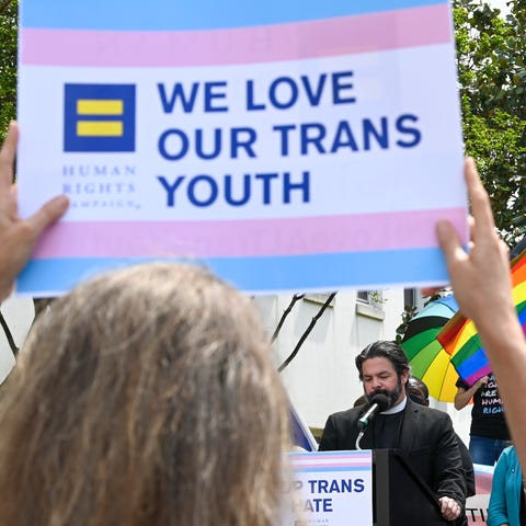 Rev. David Chatel speaks during a rally at the Ala