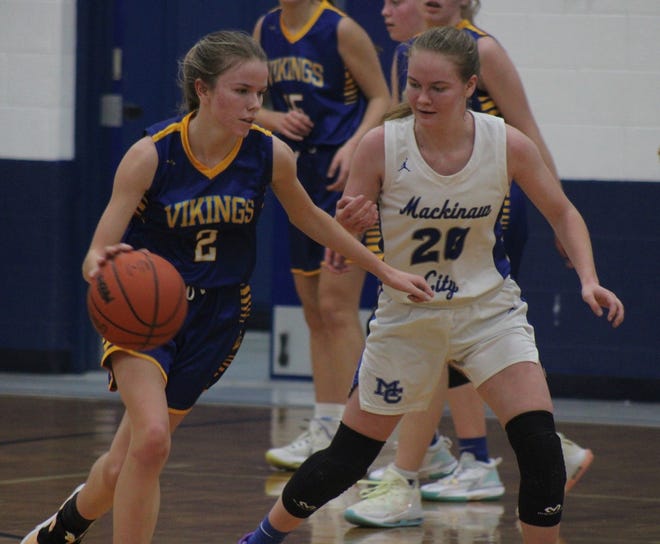 Alanson's Christina Midyett (2) looks to get past Mackinaw City's Gracie Beauchamp (20) during a recent game in Mackinaw City. Midyett and the Vikings snapped a four-game losing streak by earning a win at Wolverine on Thursday.