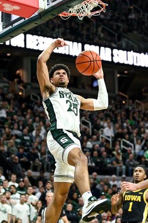 Michigan State's Malik Hall dunks agianst Iowa during the first half on Thursday, Jan. 26, 2023, at the Breslin Center in Lansing. 