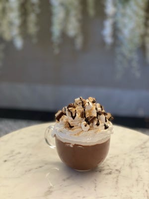 This hot chocolate s'more with whipped cream, marshmallows, chocolate sauce and graham cracker crumbs is available at the Sugar Factory.