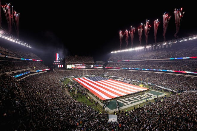 An American flag is displayed on the field during the national anthem before the NFC championship game between the Philadelphia Eagles and the Minnesota Vikings at Lincoln Financial Field on Jan. 21, 2018, in Philadelphia.