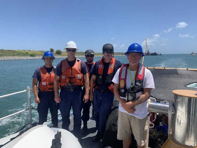 The U.S. Coast Guard rescued Steven Hicks, right, in August 2022 after his boat capsized in the Atlantic Ocean, 69 miles east of New Smyrna Beach, Florida, thanks to his emergency beacon.