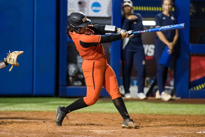 Oregon State Beavers catcher Des Rivera (2) makes contact during the seventh inning of the NCAA Women's College World Series game against the Arizona Wildcats at USA Softball Hall of Fame Stadium June 3, 2022, 
 in Oklahoma City, Oklahoma. Arizona won 3-1.