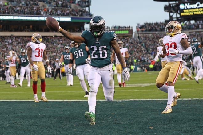 Jan 29, 2023; Philadelphia, Pennsylvania, USA; Philadelphia Eagles running back Miles Sanders (26) scores a touchdown against the San Francisco 49ers during the second quarter in the NFC Championship game at Lincoln Financial Field. Mandatory Credit: Bill Streicher-USA TODAY Sports