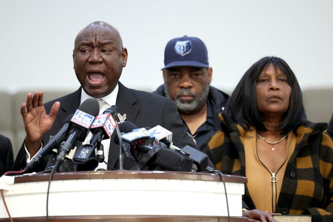 Flanked by Rodney Wells (C) and RowVaughn Wells, the stepfather and mother of Tyre Nichols, civil rights attorney Ben Crump speaks during a press conference on January 27, 2023 in Memphis, Tennessee.