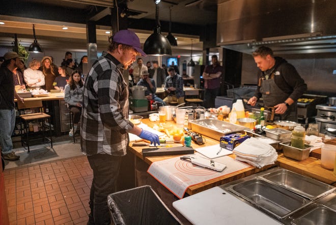 Chef Damian Ettish of Fetty’s Street Food (right) and chef Justin Gottschalk of Harvest Pizzeria in Granville battle it out for Chef Scrap bragging rights in the kitchen at Ray Ray’s Granville.