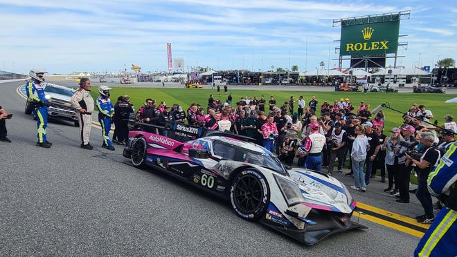 The winning Meyer Shank Racing Acura stops on the main banking to celebrate its win at the 2023 Rolex 24 Hours of Daytona.