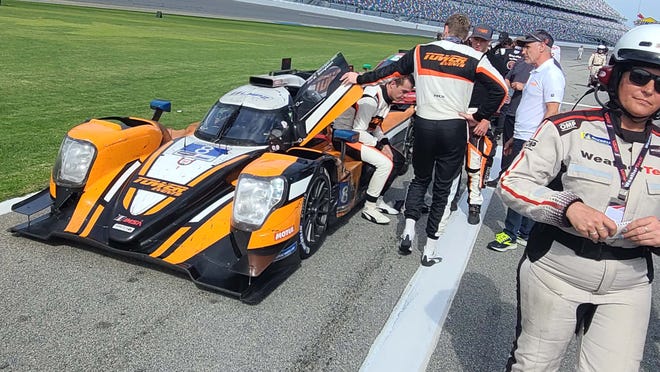 IndyCar stars were up and down the 2023 Rolex 24 Hours of Daytona grid. Scott McLaughlin (sitting) and Josef Newgarden, who race with Team Penske in IndyCar, piloted the Tower Racing Oreca LMP2 car at Daytona.