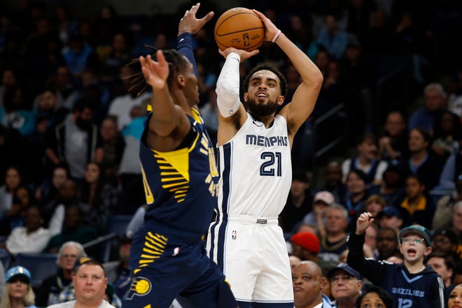 Jan 29, 2023; Memphis, Tennessee, USA; Memphis Grizzlies guard Tyus Jones (21) shoots for three during the second half against the Indiana Pacers at FedExForum. Mandatory Credit: Petre Thomas-USA TODAY Sports