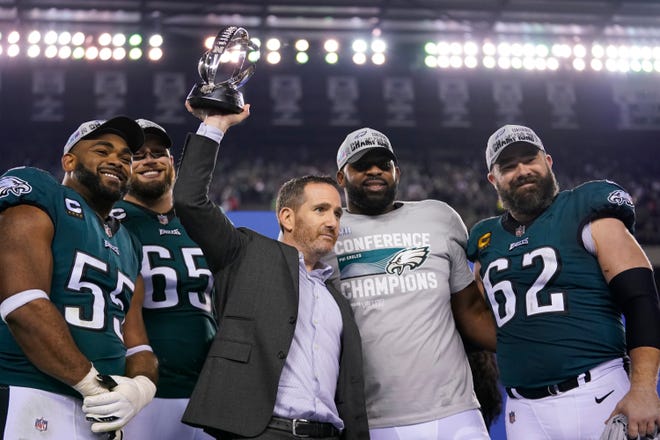 Philadelphia Eagles general manager Howie Roseman, center, stands with defensive end Brandon Graham (55) offensive tackle Lane Johnson (65), defensive tackle Fletcher Cox, and center Jason Kelce (62) after the NFC championship game between the Philadelphia Eagles and the San Francisco 49ers on Sunday, Jan. 29, 2023, in Philadelphia. The Eagles won 31-7.