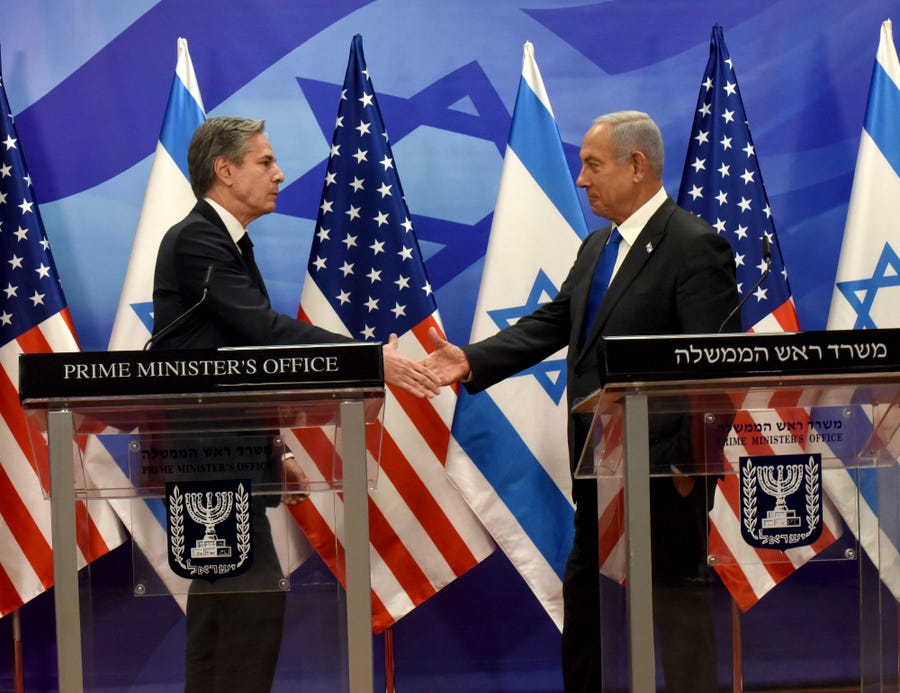 U.S. Secretary of State Anthony Blinken (left) and Israeli Prime Minister Benjamin Netanyahu shake hands after their meeting meeting at the Prime Minister's Office in Jerusalem, on Monday, Jan. 30, 2023.