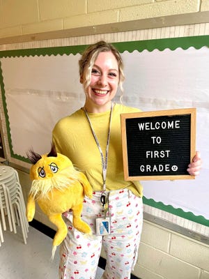 In this undated photo provided by her family and lawyers, Abigail Zwerner, a first-grade teacher at Richneck Elementary School in Newport News, Va., is shown inside her classroom.