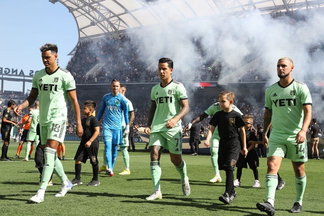 Austin FC defender Julio Cascante, left, and forwards Sebastian Driussi, middle, and Diego Fagúndez walk to the sideline prior to the 2022 Western Conference finals loss to Los Angeles FC at Banc of California Stadium. El Tree made huge strides in just its second MLS season.