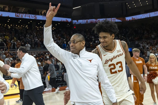 Texas interim head coach Rodney Terry and forward Dillon Mitchell celebrate a win against Baylor earlier this season. The Longhorns open the Big 12 Tournament against Oklahoma State Thursday.