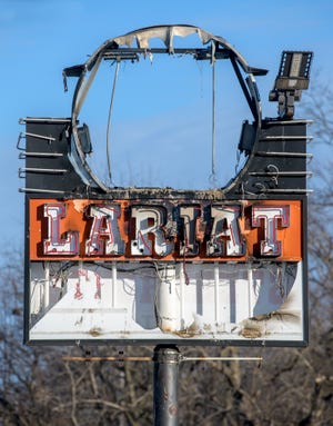 The sign at the  Lariat Steakhouse at 2232 W. Glen Ave. in Peoria caught fire Monday, Jan. 30, 2023.