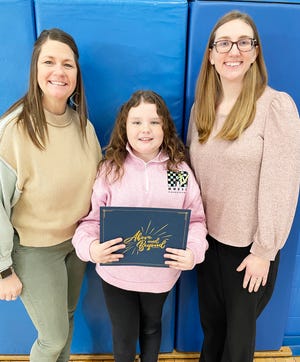 Kindergarten-4th grade Cornell student of the month for January Paisley Betken, middle, with nominating teachers  Ashley Follmer and Christina Bowman.
