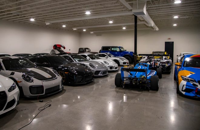 A row of member-owned Porsches are seen among other member cars in the air-conditioned storage garage at The Thermal Club in Thermal, Calif., Monday, Jan. 30, 2023. 