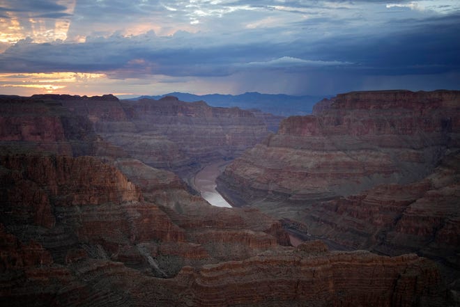 FILE - The Colorado River flows through the Grand Canyon on the Hualapai reservation Monday, Aug. 15, 2022, in northwestern Arizona. Six western states that rely on water from the Colorado River have agreed on a plan to dramatically cut their use. California, the state with the largest allocation of water from the river, is the holdout. (AP Photo/John Locher, File)