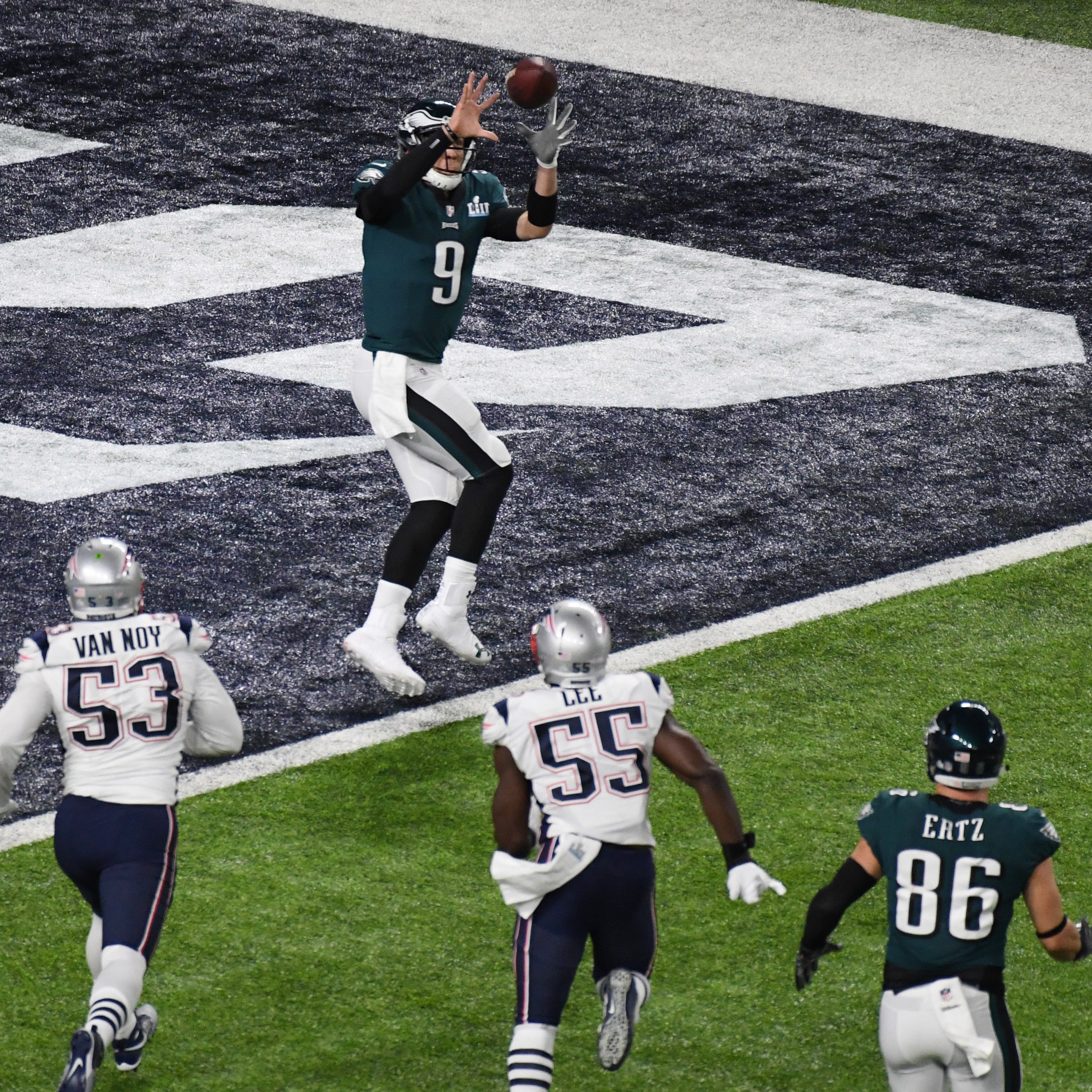 Philadelphia Eagles quarterback Nick Foles (9) catches a touchdown pass against the New England Patriots in the second quarter in Super Bowl 52 at U.S. Bank Stadium.