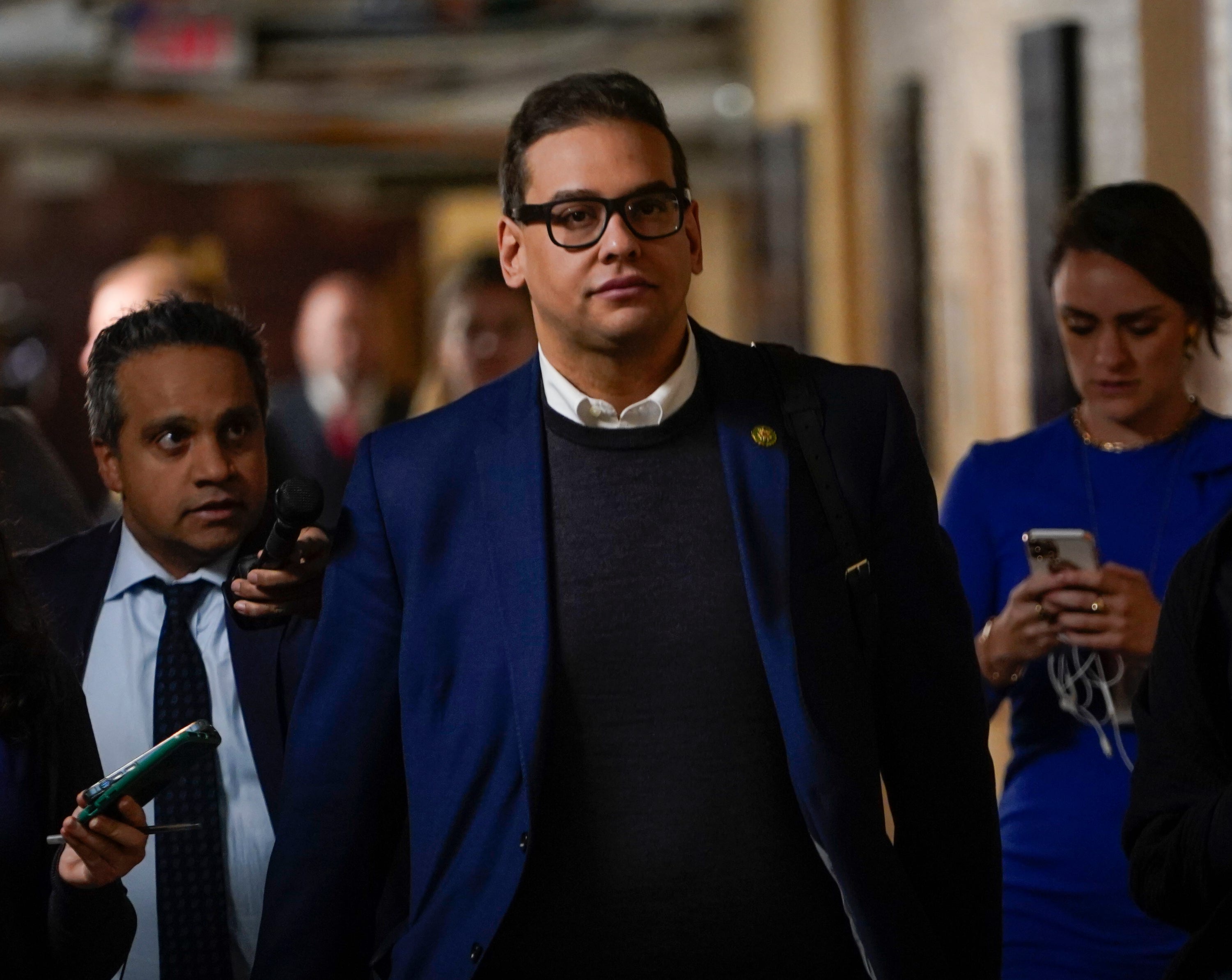 Rep. George Santos departs a morning GOP Conference meeting on Tuesday, Jan. 31, 2023, at the U.S. Capitol after telling his House Republican colleagues he would recuse himself from his committee positions. Santos indicated it may be temporary and that he would return to his committee seats once his legal and ethical reviews resolve.