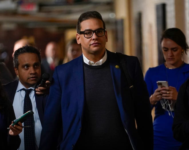 Rep. George Santos departs a morning GOP Conference meeting on Tuesday, Jan. 31, 2023, at the U.S. Capitol after telling his House Republican colleagues he would recuse himself from his committee positions. Santos indicated it may be temporary and that he would return to his committee seats once his legal and ethical reviews resolve.