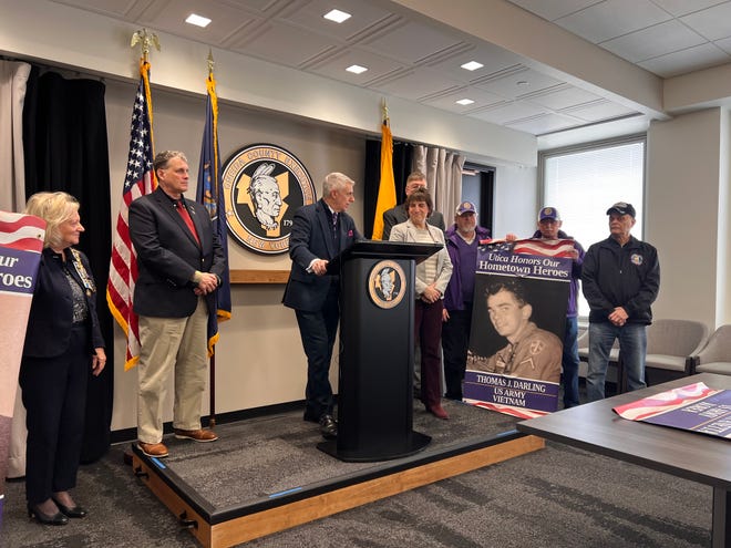 Oneida County Executive Anthony Picente Jr., center, holds a press conference Tuesday, Jan. 31, announcing the expansion of the Mohawk Valley Hometown Heroes banner program.
