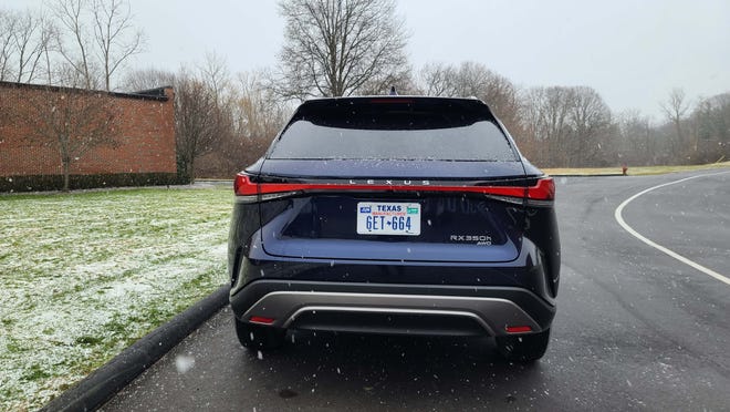 The rear of the 2023 Lexus RX350h isn't as radical as the front, but the wide LED taillight is a distinctive touch.