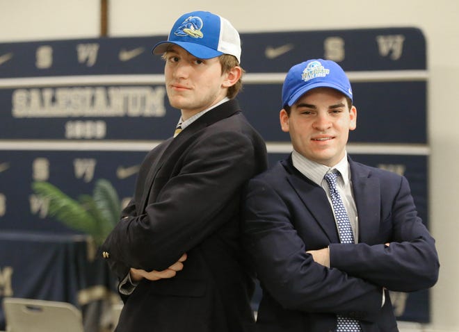 Salesianum football teammates Nate Ray (left) and James Collins will be hitting the field for the University of Delaware. They are seen at Salesianum School Wednesday, Feb. 1, 2023.