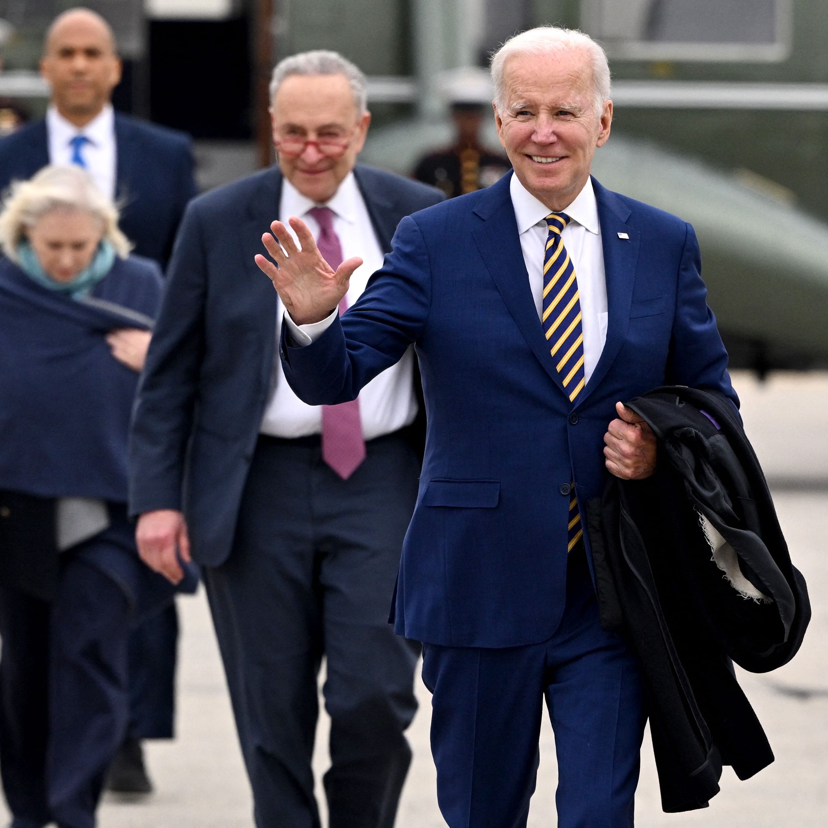 President Joe Biden, followed by Senate Majority Leader Chuck Schumer, D-N.Y., Sen.  Kirsten Gillibrand, D-N.Y., and Sen. Cory Booker, D-N.J., walks to board Air Force One at John F. Kennedy International Airport in New York City on January 31, 2023. - Biden travelled to New York to speak on how the Bipartisan Infrastructure Law will provide funding for the Hudson River Tunnel project. (Photo by Mandel NGAN / AFP) (Photo by MANDEL NGAN/AFP via Getty Images) ORIG FILE ID: AFP_3389973.jpg