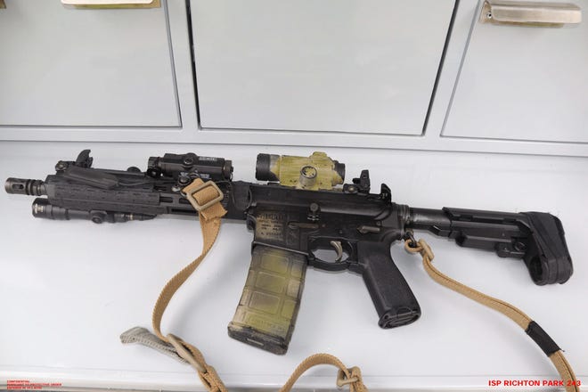 The AR-15-style rifle used in the shooting can be seen.