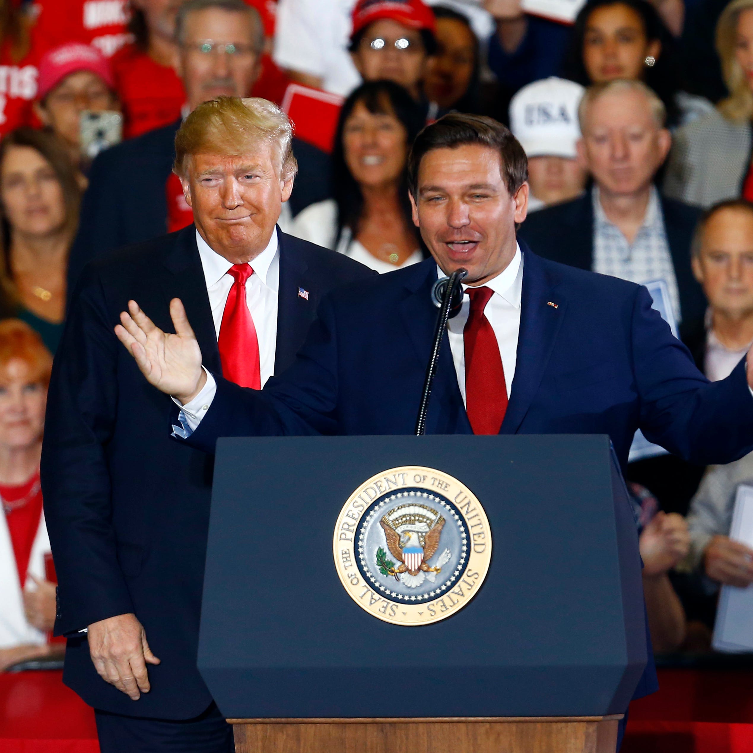 Former President Donald Trump stands behind Ron DeSantis, then a candidate for governor of Florida, at a 2018 rally in Pensacola, Fla. The former allies could find themselves competing against each other for the presidency in 2024.