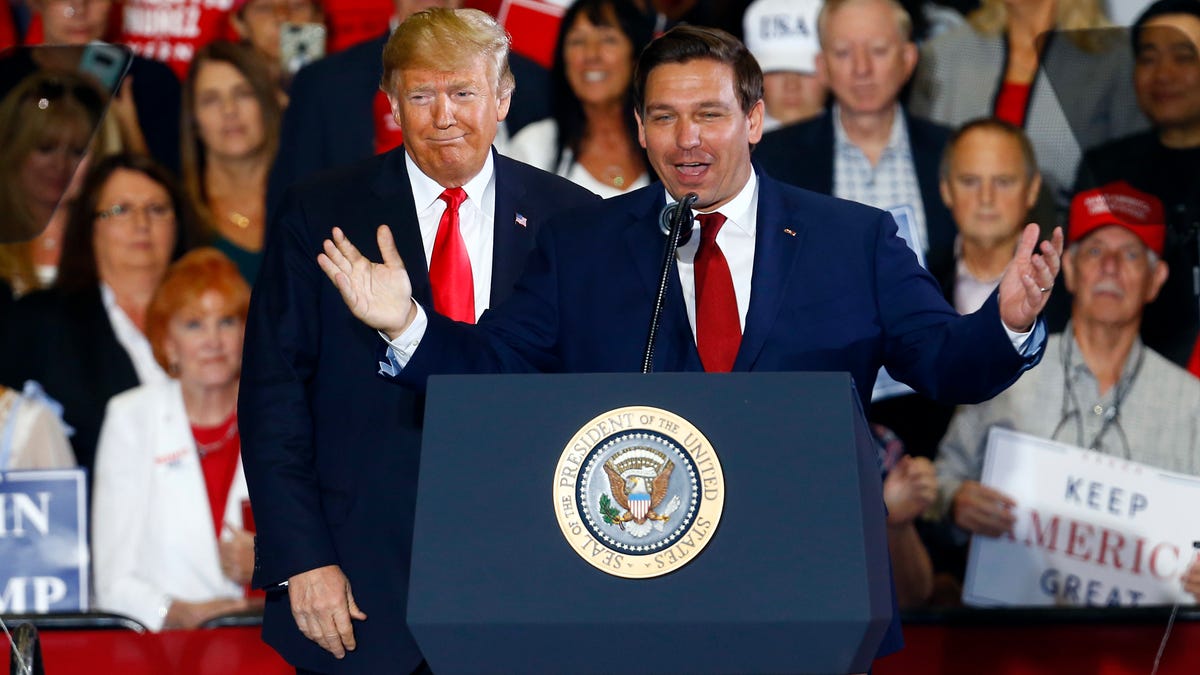 Former President Donald Trump stands behind Ron DeSantis, then a candidate for governor of Florida, at a 2018 rally in Pensacola, Fla. The former allies could find themselves competing against each other for the presidency in 2024.