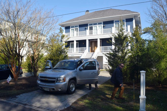 U.S. Secret Service agents are seen in front of Joe Biden's Rehoboth Beach, Del., home on Jan. 12, 2021. The FBI is conducting a planned search of President Joe Biden’s Rehoboth Beach, Delaware home as part of its investigation into the potential mishandling of classified documents.