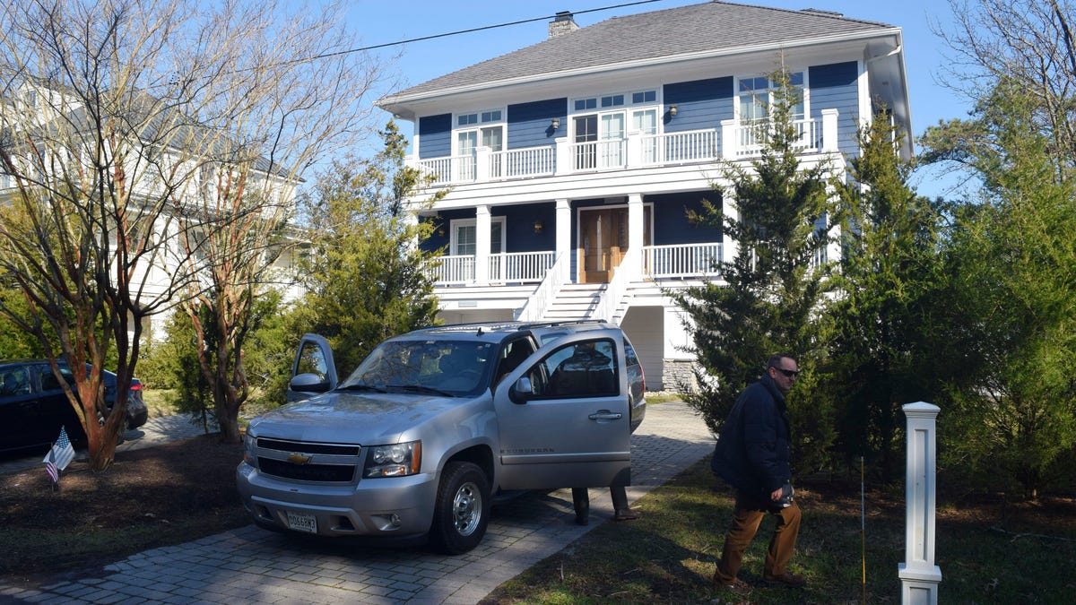 U.S. Secret Service agents are seen in front of Joe Biden's Rehoboth Beach, Del., home on Jan. 12, 2021. The FBI is conducting a planned search of President Joe Biden's Rehoboth Beach, Delaware home as part of its investigation into the potential mishandling of classified documents.