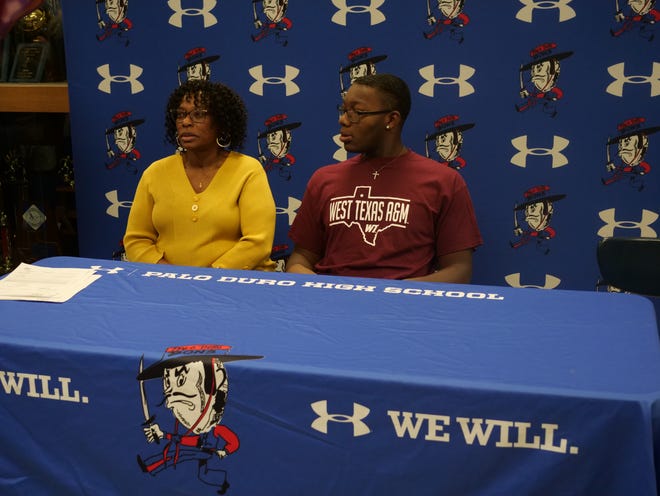 Triston Moore (right) signed his National Letter of Intent to play football for West Texas A&M University as part of National Signing Day on Wednesday, February 1, 2023 at Palo Duro High School.