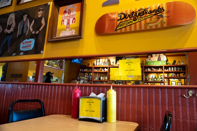 Zach Ragely, from Hilliard, looks towards the door during the pre-open morning hours while the staff sets up at Dirty Frank’s Hot Dog Palace on Thursday morning, Feb. 2, 2023.
