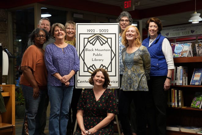 Members of Friends of the Black Mountain Library pose in celebration of the library's 100th anniversary last year.