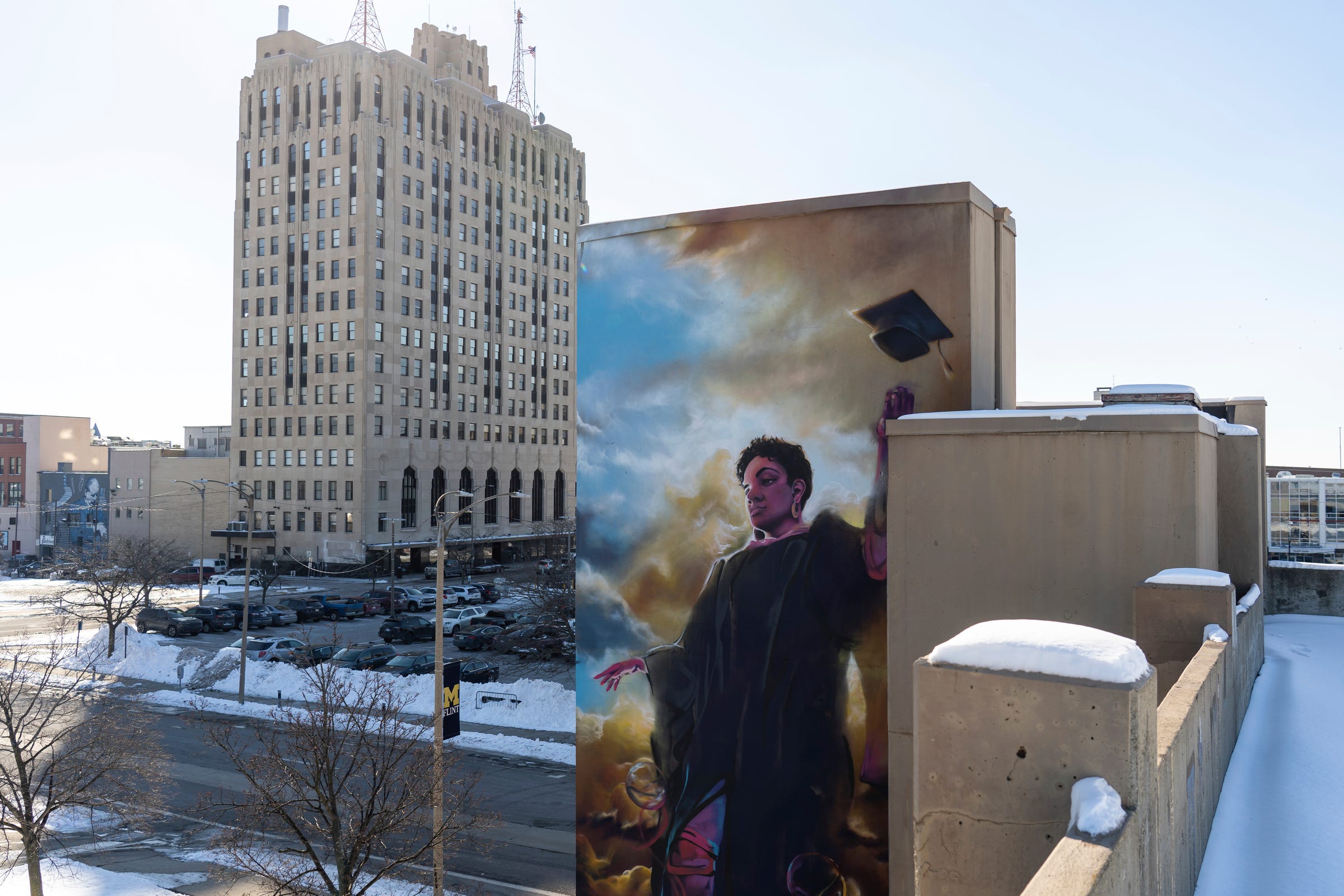 A mural is painted on the side of a parking garage at the U-M Flint campus in downtown Flint on Wednesday, Feb. 1, 2023, near the Mott Foundation Building.