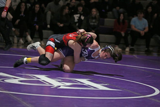 Ross' Ella Warner wrestles Port Clinton's Cadence Wallace in a 135-pound match.