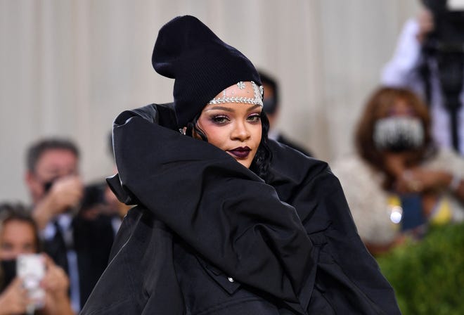 Singer Rihanna is working with musical director Adam Blackstone of Middletown, Delaware, for her halftime show at the 2023 Super Bowl at State Farm Stadium in Arizona on Sunday, Feb. 12. Rihanna is shown arriving for the 2021 Met Gala at the Metropolitan Museum of Art on Sep. 13, 2021, in New York.