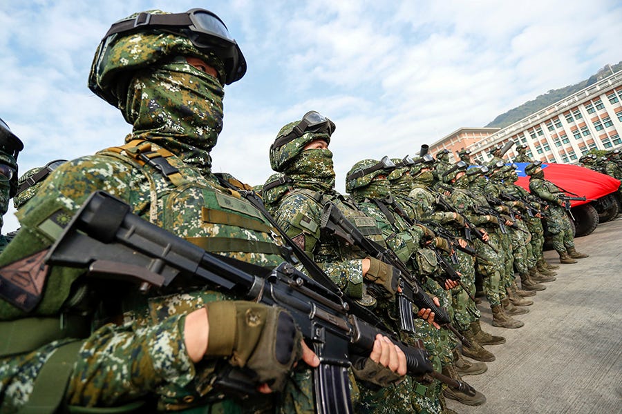 Taiwanese soldiers stand guard in Kaohsiung City after a drill simulating defense against invasion by China on Jan 11.