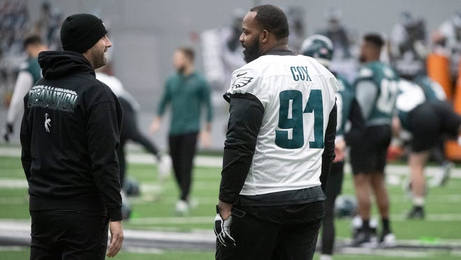 Philadelphia Eagles' head coach Nick Sirianni, left, speaks with Eagles' defensive tackle Fletcher Cox during an Eagles practice held at the NovaCare Complex in Philadelphia on Friday, Feb. 3, 2023.  The Philadelphia Eagles will play the Kansas City Chiefs in Super Bowl LVII in Arizona on Sunday, Feb. 12, 2023.