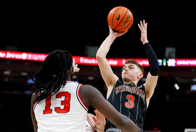 Wisconsin Badgers guard Connor Essegian puts up a lean-back jumper over Ohio State Buckeyes guard Isaac Likekele during the first half Thursday night.