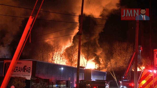 In this image from Jordan Miller News, a fire burns in train cars Feb. 3 after a train derailment in East Palestine, Ohio.