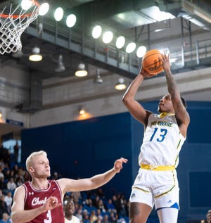 Delaware's Jyare Davis shoots over Charleston's Dalton Bolon  Saturday at the Carpenter Center.