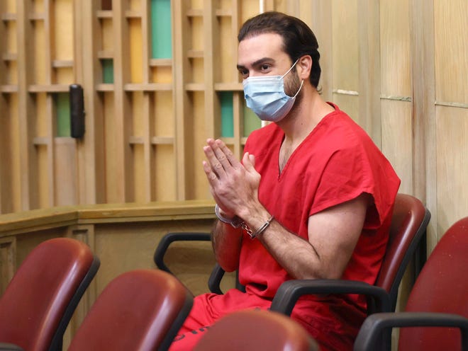 Pablo Lyle gestures toward family members as they appear in court at the Richard E. Gerstein Justice Building in Miami, on Monday, Dec. 12, 2022.